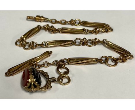 A 9ct rolled gold fancy link Albert chain, with twisting and ring link sections, 38cm long, 26g gross; terminating with a thr