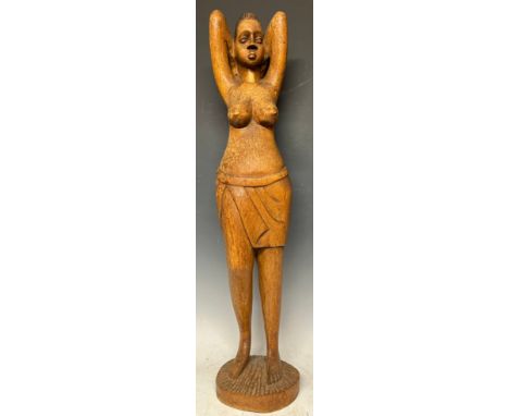 Tribal Art - a North African carved wooden figure, of a woman parting her hair, circular base, 66cm high overall