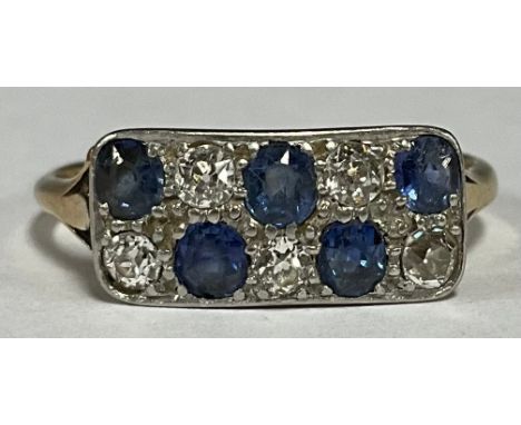 An 18ct gold and platinum ring set with sapphires and diamonds 