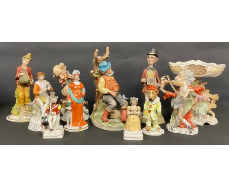 An Unter Weiss Bach porcelain figure, of a dog as a clown, 15.5cm high; a Capodimonte figure, of a gamekeeper, 27cm high; a p