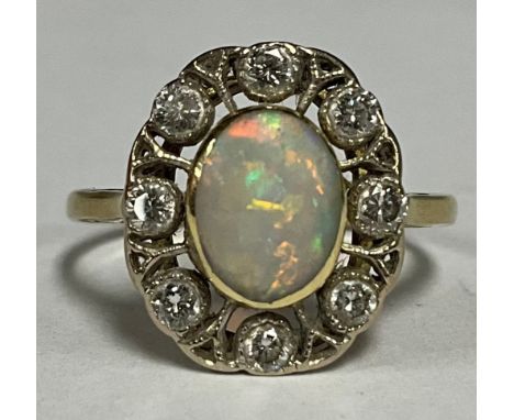 An 18ct gold opal and diamond ring 