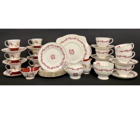 A Minton Carmine pattern tea service for six, comprising cups, saucers, sugar bowl, cream jug, etc; a Susie Cooper coffee ser