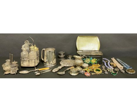 A silver napkin ring, Birmingham 1932; a silver backed hand mirror; WWI sweetheart brooches; plated cruet set; costume jewell
