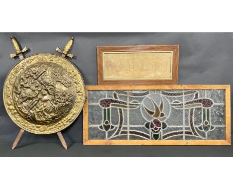 An Art Nouveau stained glass window, lead borders, 102cm x 42cm; an early 20th century needlework sampler, God is Love, 17cm 