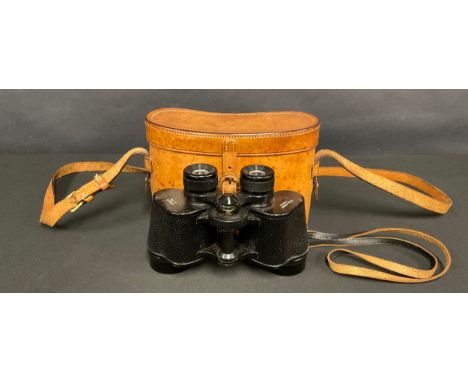 A pair of early to mid-20th century binoculars, by Dolland, London, leather case