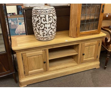 Contemporary light oak two door entertainment unit and barrel stool.