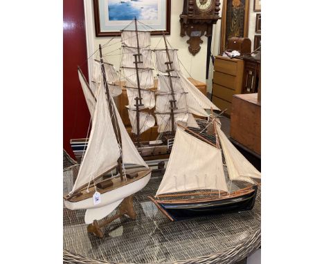 Large model galleon and two pond yachts.