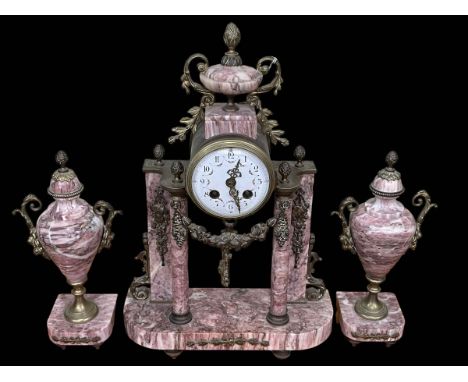 Three piece marble and gilt clock garniture.