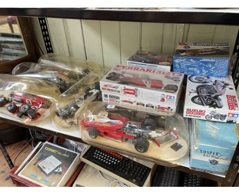 Collection of Formula 1 and other model kits.