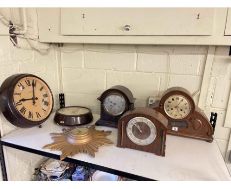 Three arch top mantel clocks, two Bakelite clocks and Sunburst clock.