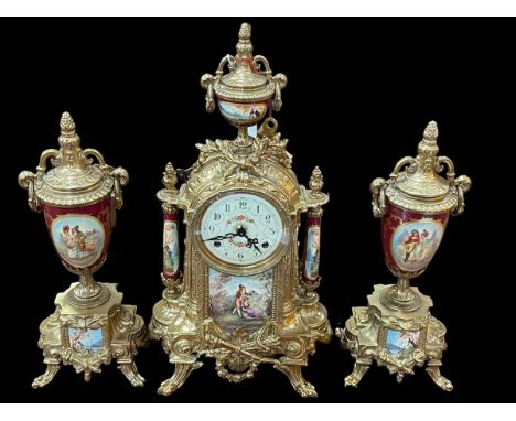 Brass and figure decorated three piece clock garniture.