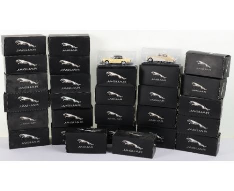 Twenty-nine Atlas small scale Jaguar models, various Jaguar models on stands in original boxes with inner packing, all excell