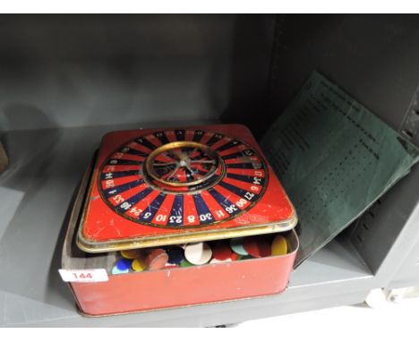 A vintage Turf cigarette advertising tin as a roulette wheel