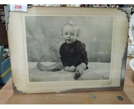 A vintage art deco photo frame with chromed edge