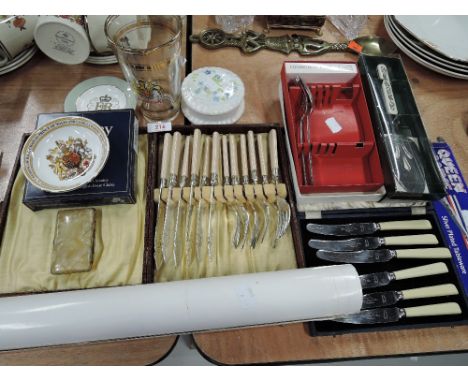 A selection of vintage curios and trinkets including fish cutlery set