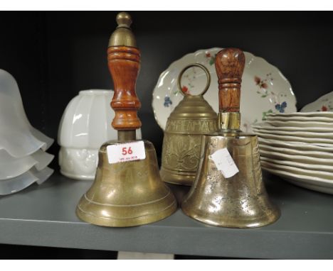 A selection of vintage brass cast door and similar brass bells