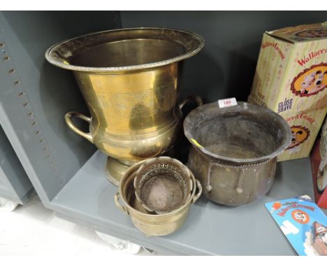 A selection of vintage planters including large brass urn style