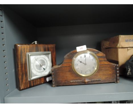 A vintage oak bodied mantle clock and similar barometer 