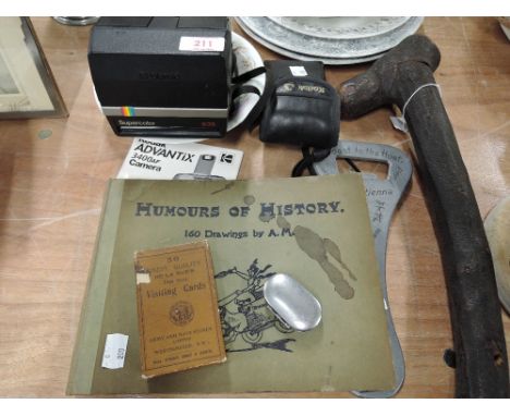 A selection of vintage curios and trinkets including Polaroid camera