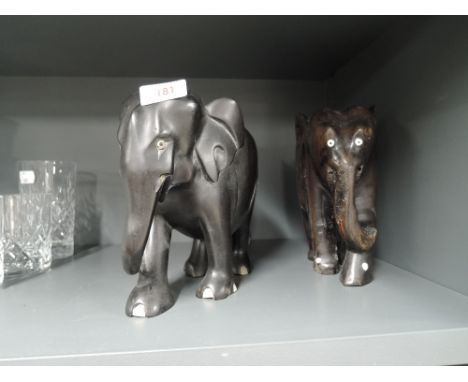 A selection of vintage heavy ethnic wood elephants with African design