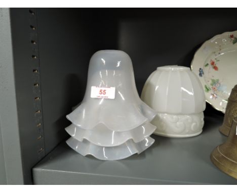 Three glass light shades and a ceramic lamp shade