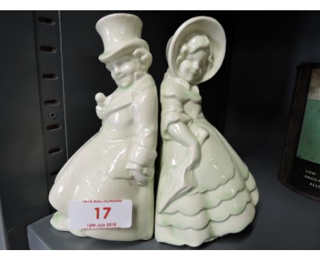 A pair of vintage ceramic book ends modelled as two gentleman and lady