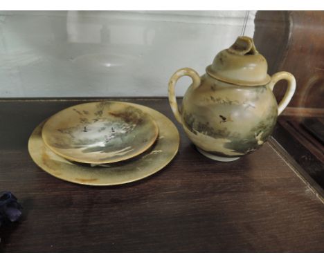 A vintage lidded oriental jar and two matching plates with stamp to base and enamel detail