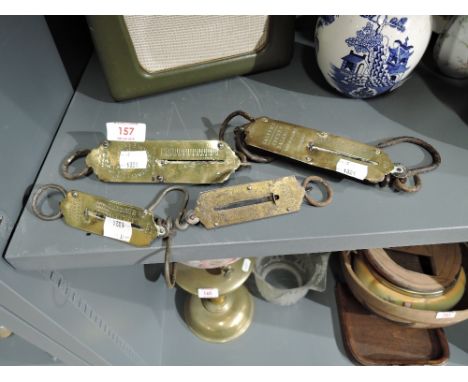 A selection of vintage brass cast pocket and spring balance scales including Salters