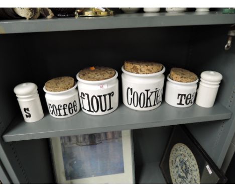 A selection of vintage kitchen jars with label prints