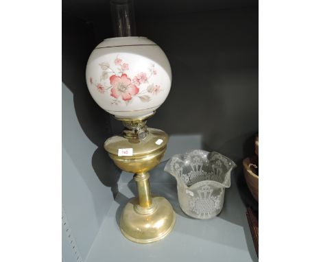 A vintage oil burning lamp with transfer printed glass shadeSlight casting fault-bubbles but no cracks or damage