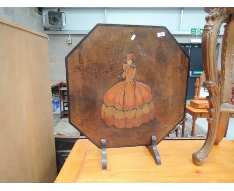 A vintage wood firescreen with crinoline lady decoration