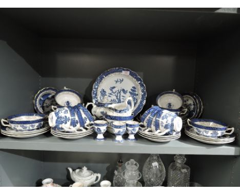 A selection of vintage part dinner service by Booths in the Old Willow pattern