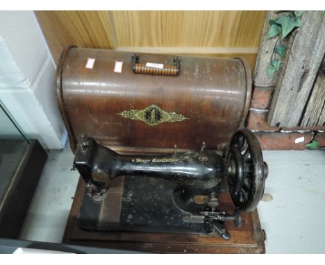 A vintage hand crank sewing machine by Singer rd 11747124