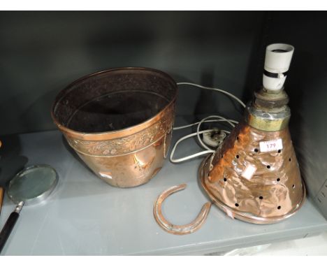 A selection of vintage copper items including horse shoe and arts and crafts style planter