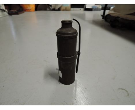 A small brass cast container possibly oil light 
