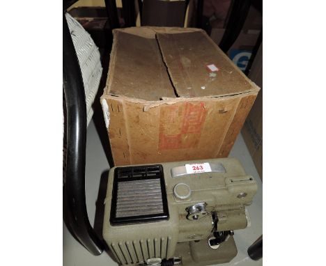 A vintage film projector by Eumig with box