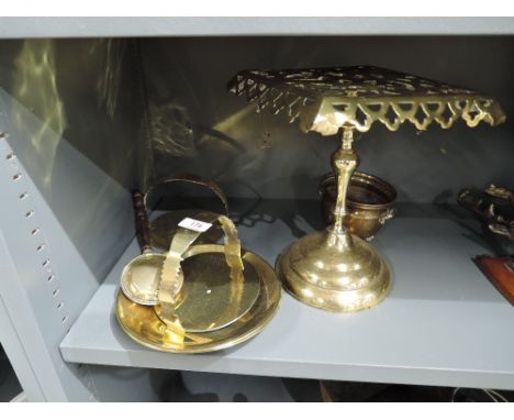 A selection of vintage cast brass items including fire side stand