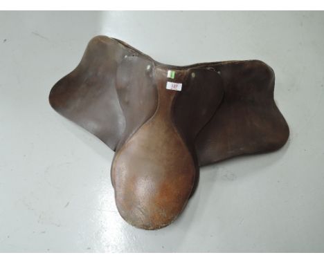A vintage leather riding saddle in an English design