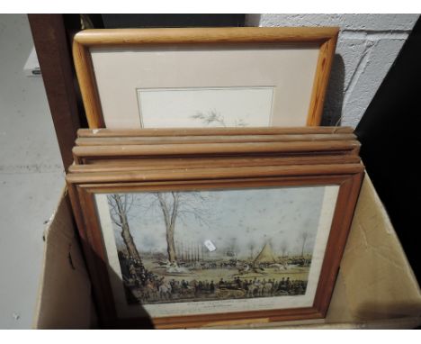 A selection of vintage prints and pine frames