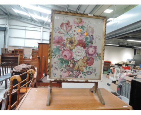 A vintage gilt framed firescreen/table having silk floral pictorial decoration
