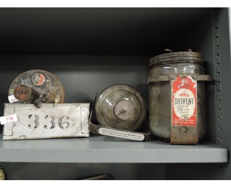 A selection of vintage garage and motor items including Trico oil jars