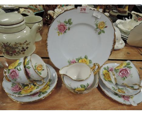 A vintage part tea service in fine bone china with floral print work