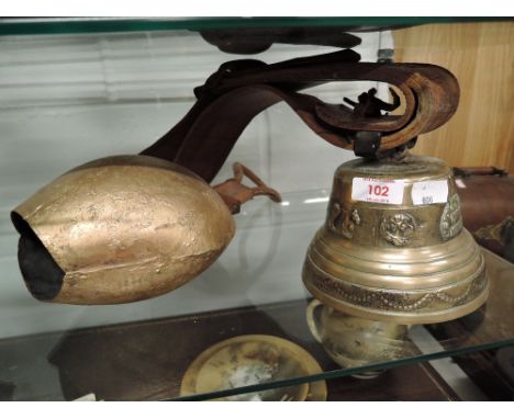 Two vintage bells one brass cast marked Jeanobertino Fohdeur Morteau
