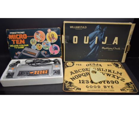 A William Fuld talking board set Ouija board, John Waddington Ltd; a Prinztronic Micro Ten Deluxe Colour TV Game; a Marx Thre