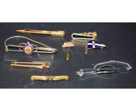 Gentlemen's Items - an enamelled 9ct gold flag tie pin; others, steam train, arrow, etc (8)