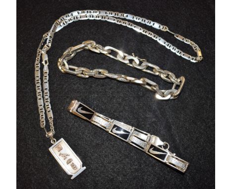A silver and enamel bracelet; a heavy chain link bracelet; a gold mounted pendant on chain (3)