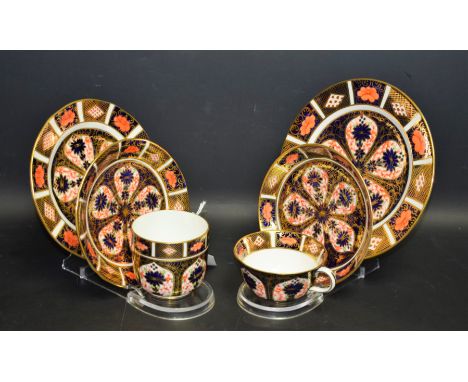 A Royal Crown Derby 1128 Imari pattern trio, teacup, saucer and side plate; another, similar trio; all first quality (6)