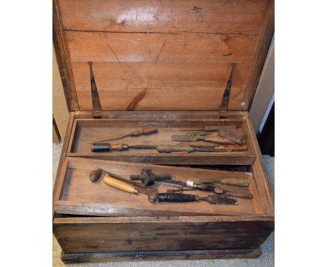 A pine tool chest with carpentry tools