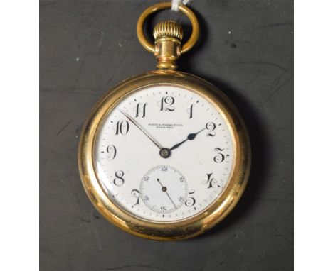 An American gold plated open face pocket watch, Porte &amp; Markle, Winnipeg, white enamel dial, Arabic numerals, minute trac