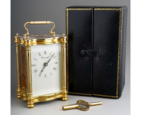 A Churchill brass carriage clock, white dial with Roman numerals, approx 11cm high, boxed with key